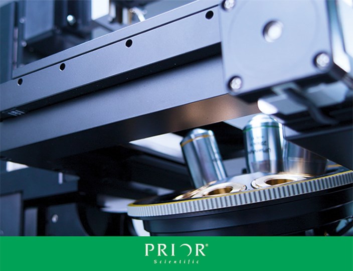 Close up of a motorized microscope stage and nosepiece on an Inverted OpenStand imaging system