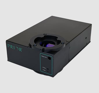 PureFocus690 hardware laser autofocus system on a grey background.